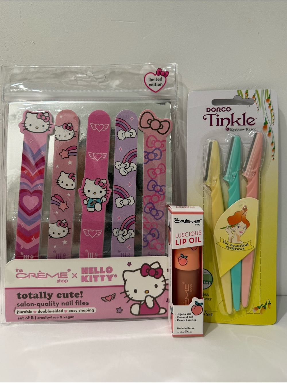 The Crème Shop Bundle – Hello Kitty Nail Files, Peach Lip Oil, Eyebrow Razors